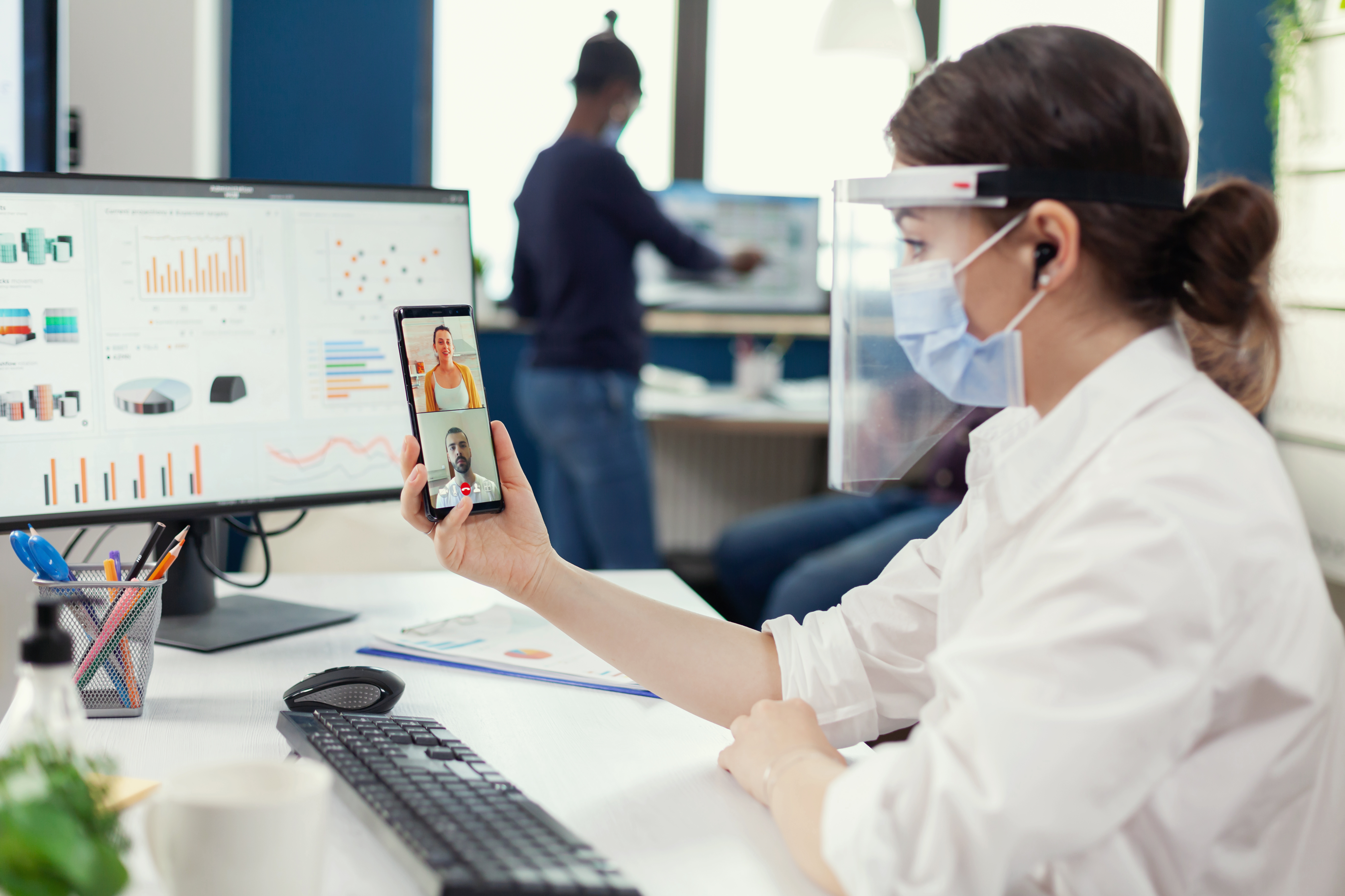 Healthcare professionals working with modern technology